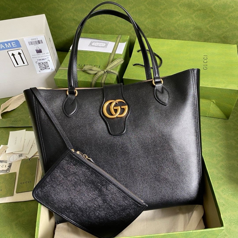 G*u*i shopping bags